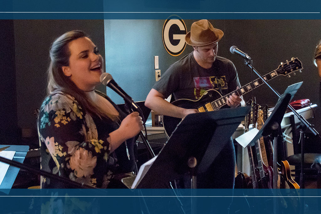 Music ed student sings with Joseph Abramo playing guitar.