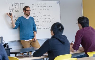 A teacher leads a math class